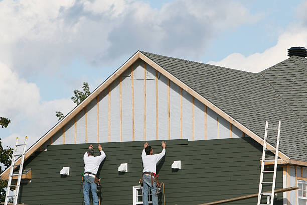 Professional Siding Installation technician working in Arlington, NY
